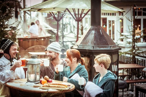 A group drinks mulled wine